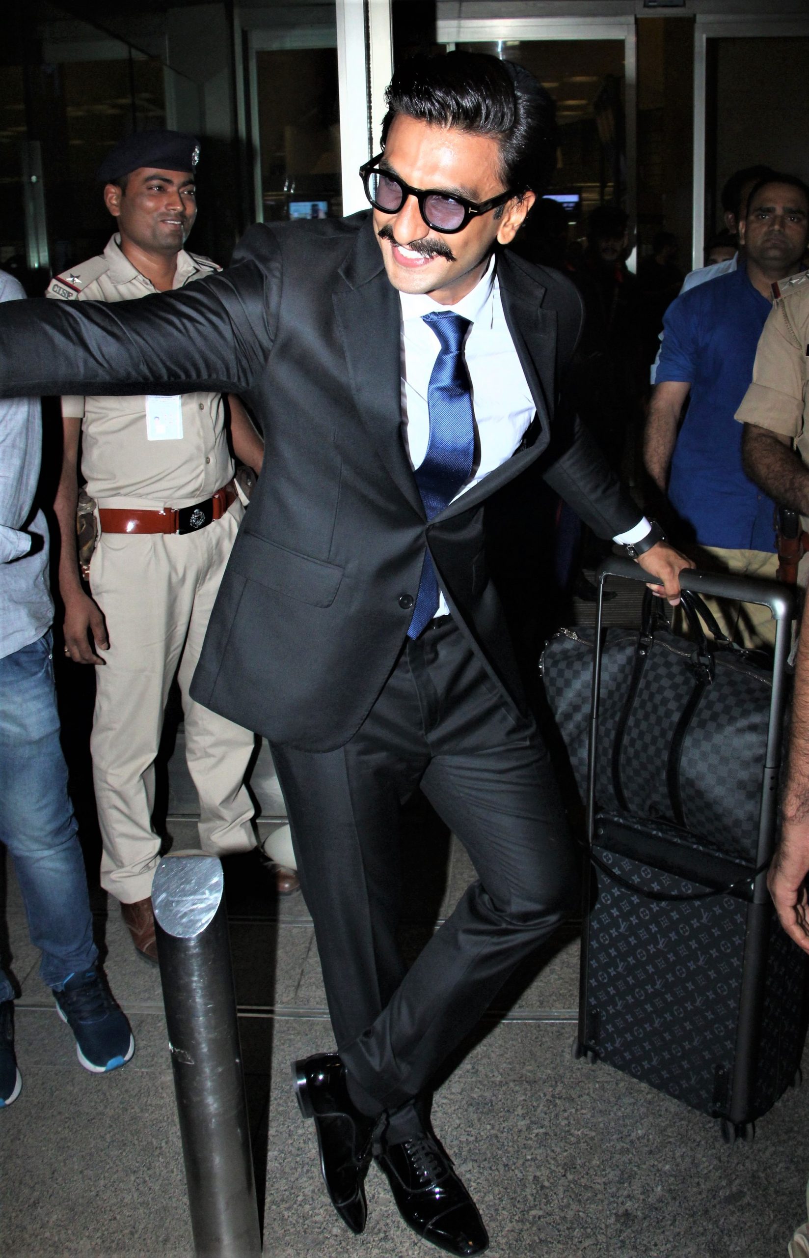 Ranveer Singh looks dapper in a blue suit as he poses for the paparazzi