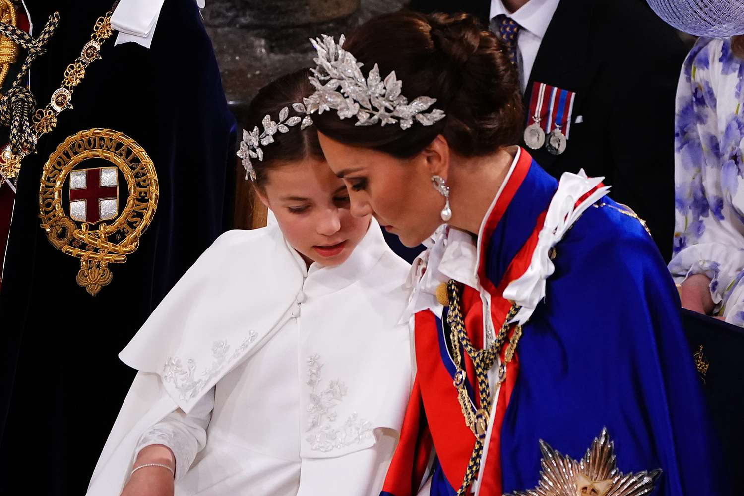 

Did you notice that Princess Kate, the princess of Wales, and her daughter Princess Charlotte, wore matching flower crowns at the Coronation of King Charles?

At the coronation of her grandfather, King Charles, Princess Charlotte wore a delicate silver bullion and crystal flower crown by Jess Collet and Alexander McQueen as she attended the historic ceremony at Westminster Abbey.

The headpiece matched her mother, Princess Kate Middleton, who also chose such an intricate diadem by the designer in lieu of a tiara. The eight-year-old wore a simple white sheath dress, also by McQueen, with embroidery featuring rose, thistle, daffodil, and shamrock motifs—the four flowers of the United Kingdom—to accompany the statement piece of jewelry. She stood patiently alongside her mother, who was dressed in full royal regalia.

It’s important to note that the significance of the moment goes far beyond an (albeit beautiful) outfit coordination. The jewelry design for both Princess Kate and Princess Charlotte is seemingly a nod to a motif used throughout Charles’s coronation of the Green Man. An ancient figure from British folklore, the Green Man symbolizes spring and rebirth. He wears a crown of oak, ivy, and hawthorn, and the emblematic flowers.

Follow us on @masalauae and masala.com to stay in touch with fashion news.

jQuery(function($){

				$("#main img").each(function(){

					var $this = $(this), flag = "";	
					if (this.hasAttribute("alt") === false)
						//text = " has no alt attribute";
                        flag=1;
					else if ($this.attr("alt") === "")
						//text = " has an empty alt attribute";
                        flag=1;
					else
						//text = " has an alt attribute of '"+$this.attr("alt")+"'";
                        flag=0;
                    if(flag==1){
					var trimStr = $.trim($("#main h1").text());
					if($this.parent().hasClass("post-thumbnail")){
					$this.attr('alt',trimStr);
					}
					else
					{
					if($this.next().text() === "")
					$this.attr('alt',trimStr);
					else
					$this.attr('alt',$this.next().text());
					}
                    }
				});			
			});

		Tagged: British Royal Family, Coronation, Princess Kate	

