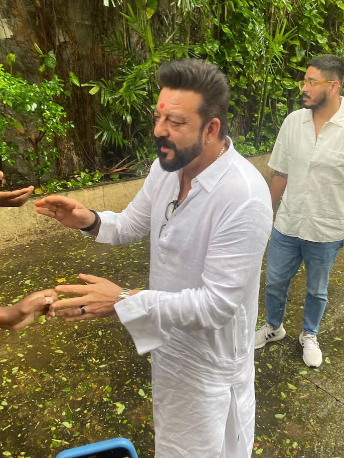 Sanjay Dutt nails the "Vaastav" look for his 64th birthday as he greets fans - See ALL the pics here