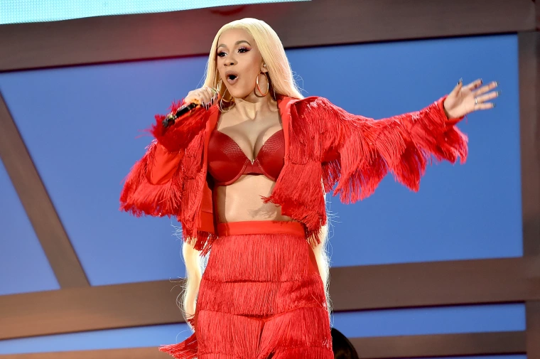 WATCH: Cardi B hurls her mic at fan who threw drink on her