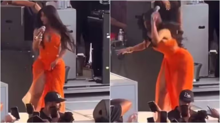 WATCH: Cardi B hurls her mic at fan who threw drink on her