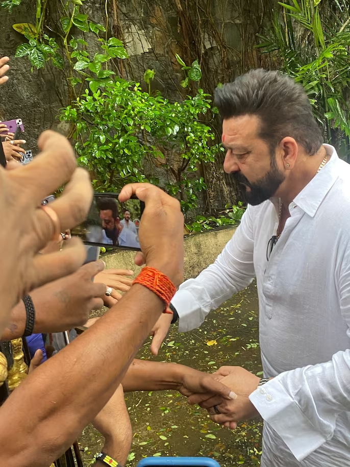 Sanjay Dutt nails the "Vaastav" look for his 64th birthday as he greets fans - See ALL the pics here